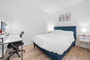 Queen sized bed, with work table for a professional 