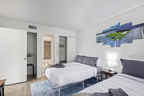 This inviting bedroom provides a perfect place to relax and recharge. The comfy bed beckons you to unwind after a long day, while the nightstand and dresser offer storage for your belongings. The large window lets in natural light, making the room feel warm and welcoming. 