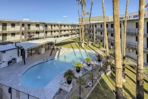 Soak up the sun and relax on the poolside chairs after taking a dip.