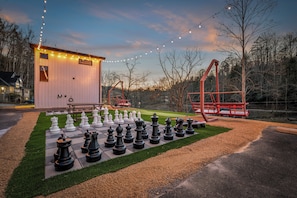 Challenge your crew to a giant chess match or kick back on the custom ober swings as the string lights glow.