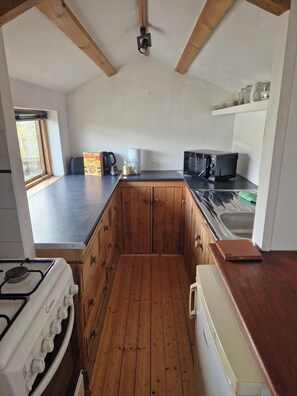 galley kitchen with toast and cereal provided