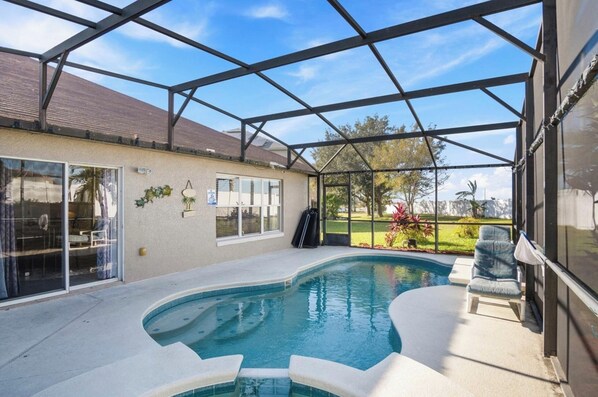 Take a dip in the private screened in pool