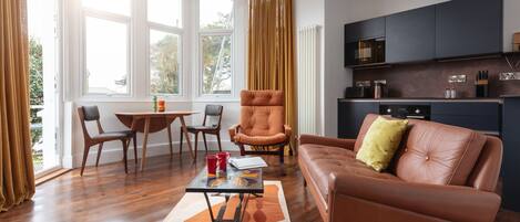 Open plan living/dining/kitchen area with direct access to terrace