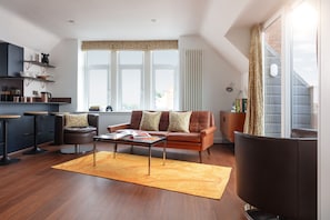 Open plan living area with balcony