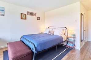 Comfortable queen bed with soft linens—perfect for a good night’s sleep.