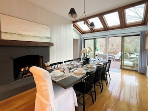 Cozy up by the crackling fire in the dining table with seating for 10, an additional 4 at the bar and more seating outside on the spacious deck with views of the river.
