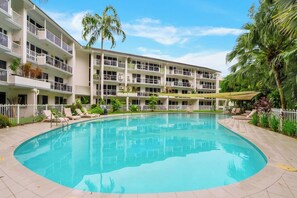 Cool off in the palm-fringed lagoon pool or stretch out on a sunlounger and soak in the relaxed rhythm of resort living.