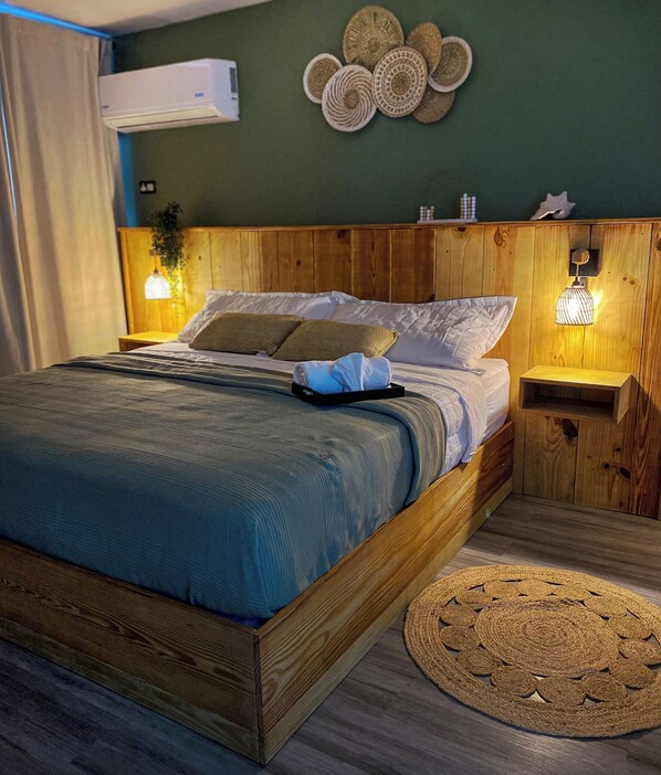 A cozy and comfortable King Size Bed awaits you.