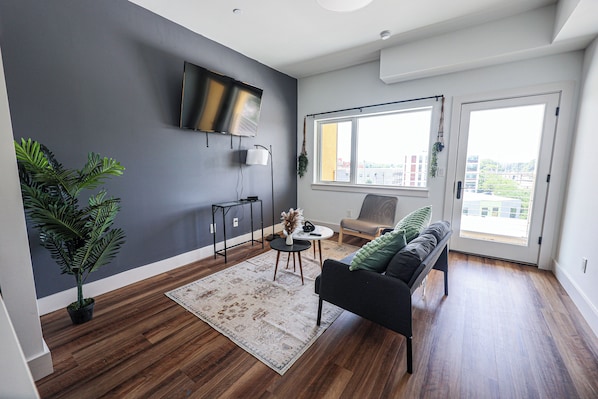 Step into our apartment, where the living space seamlessly transitions into an open kitchen and dining area. The airy layout fosters a sense of spaciousness and connectivity, creating an inviting ambiance for relaxation, culinary adventures, and shared meals with loved ones.