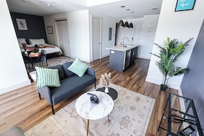 Step into our apartment, where the living space seamlessly transitions into an open kitchen and dining area. The airy layout fosters a sense of spaciousness and connectivity, creating an inviting ambiance for relaxation, culinary adventures, and shared meals with loved ones.