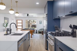Sleek modern fixtures and gourmet appliances await your culinary adventures!