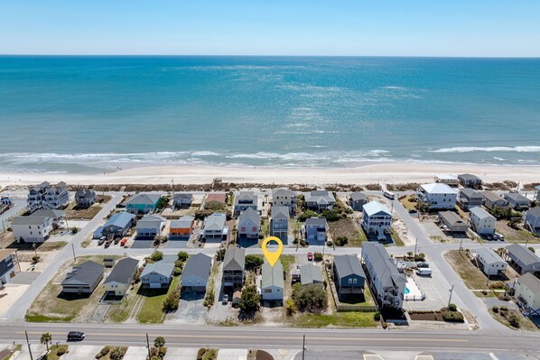 Just one row from the ocean, offering breathtaking views and quick beach access