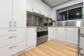 Kitchen with beautifully appointed appliances to make cooking a delight
