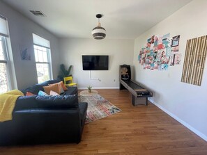 Hip Entertainment Area & Game Room featuring Smart TV and Skee-Ball