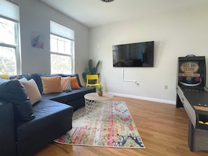Hip Entertainment Area & Game Room featuring Smart TV and Skee-Ball