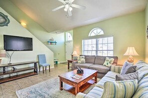 Spacious living room with a sleeper sofa and smart TV