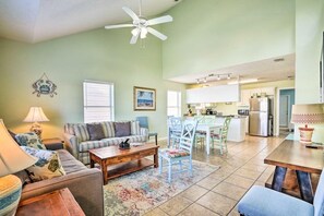 Spacious living room with a sleeper sofa and smart TV