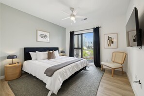 Bedroom one with skyline views, Smart TV, King bed, ensuite bathroom