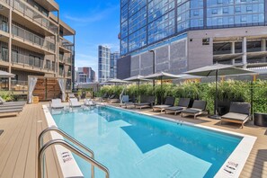 Common Area with seasonally heated pool, cabanas, loungers, fire pit, and more