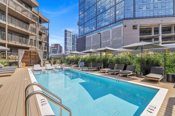 Common Area with seasonally heated pool, cabanas, loungers, fire pit, and more
