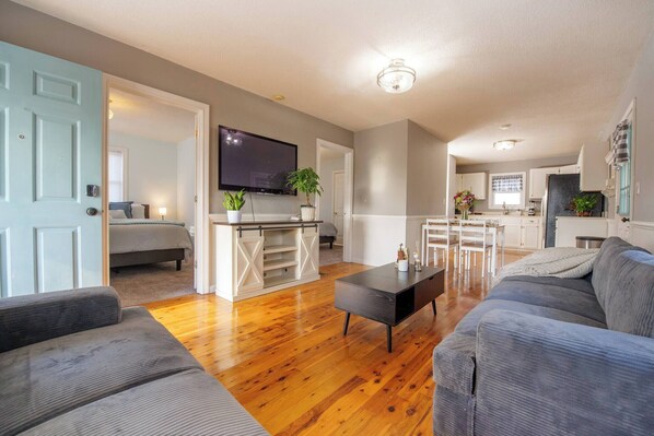 Living Room: Bright and airy space with comfy seating and modern decor, perfect for relaxation!