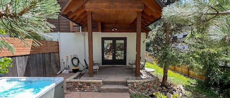 Relax in the hot tub or enjoy shaded conversations in the covered area with seating for four.