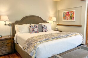 The spacious primary bedroom features a luxurious king bed, perfect for restful nights and sweet dreams.