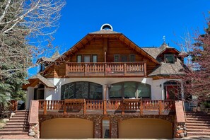 The stunning Swiss-inspired architecture brings a touch of alpine elegance to the exterior of the home.