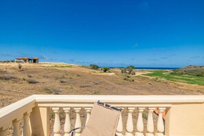 Breathtaking views from the balcony, where land meets sea.