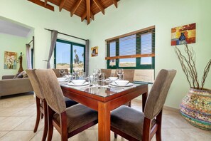 Bright dining area ready for a meal with a view.
