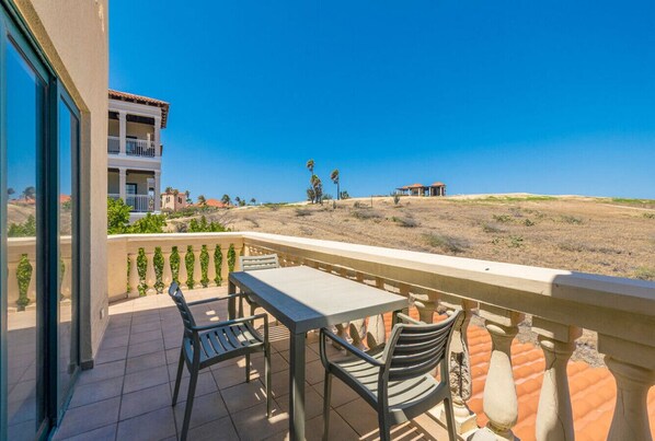 Enjoying serene views from the balcony, where relaxation meets nature.