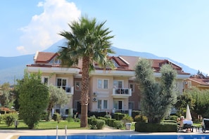 The apartment (top middle) from the pool.