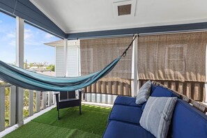 Enjoy the view from our cozy balcony terrace. We also include a hammock for maximum comfort!
