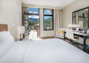 Two queen beds with balcony access