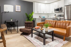 Our living room welcomes you with a burst of vibrant colors, creating an uplifting and vibrant atmosphere for your enjoyment. #VibrantSpaces #ComfortableLiving 