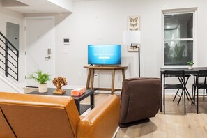 Immerse yourself in the dynamic energy of our living room, where a colorful vibe sets the stage for unforgettable moments.
