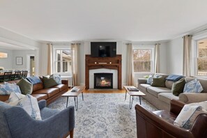 Lounge in the formal living room with a Smart TV and fireplace