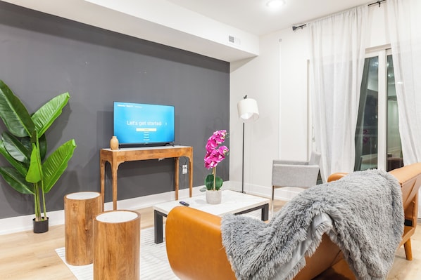 Experience the perfect blend of style and comfort in our living room, with its colorful vibe that adds a lively touch to your stay. #ColorfulAmbiance #VibrantLiving