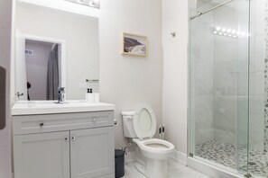 Refresh and rejuvenate in the stylish bathroom, designed with meticulous attention to detail and equipped with modern comforts for your convenience.