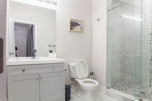 Refresh and rejuvenate in the stylish bathroom, designed with meticulous attention to detail and equipped with modern comforts for your convenience.