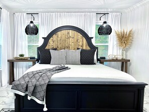 Primary bedroom king bed, therapeutic mattress, ceiling fan, walk-in closet