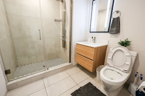 Experience the epitome of comfort and style in the meticulously crafted bathroom, where every detail is designed to enhance your well-being and relaxation