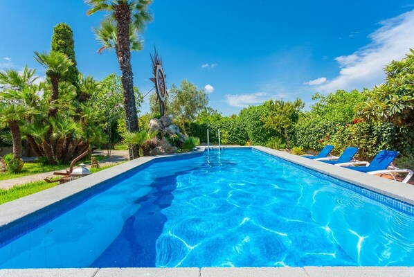 Private pool, terrace, and lawn