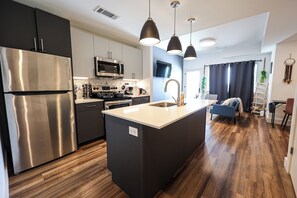 Fully equipped for your inner chef! From morning coffee to midnight snacks, this modern kitchen features all the essentials