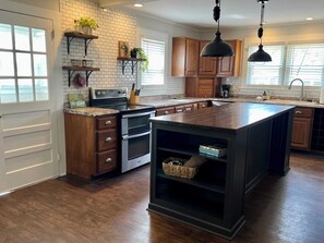 Large and updated kitchen with all of the items you need to prepare meals at home.