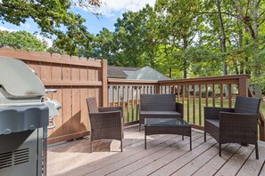 View of the back deck area with gas grill.