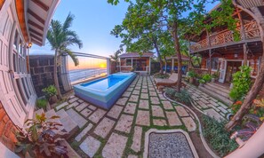 The Beach House Goldern Hour.   Our sunsets are undefeated.   Come see it in real life sitting our our his and her swings overlooking the rolling waves.
