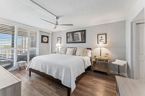 Primary Bedroom - Large King Bed w/ patio view