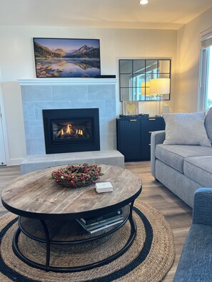 Living Room with smart tv, and gas fireplace.