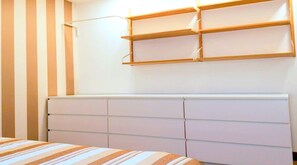Plenty of drawers for your clothes. Hanger on the left